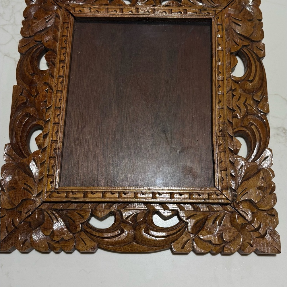 Intricately Carved Brown Wooden Frame